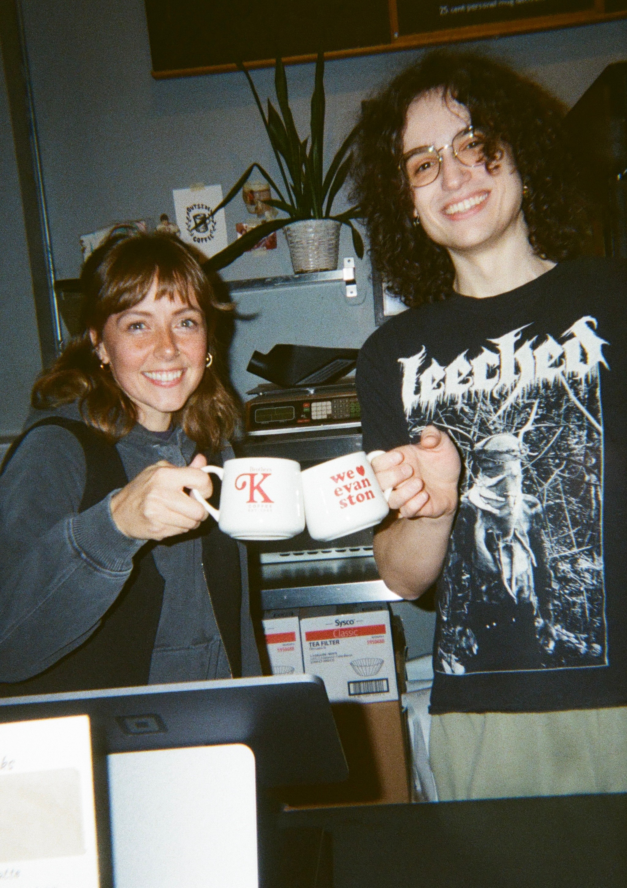 Molly and barista cheers with mugs