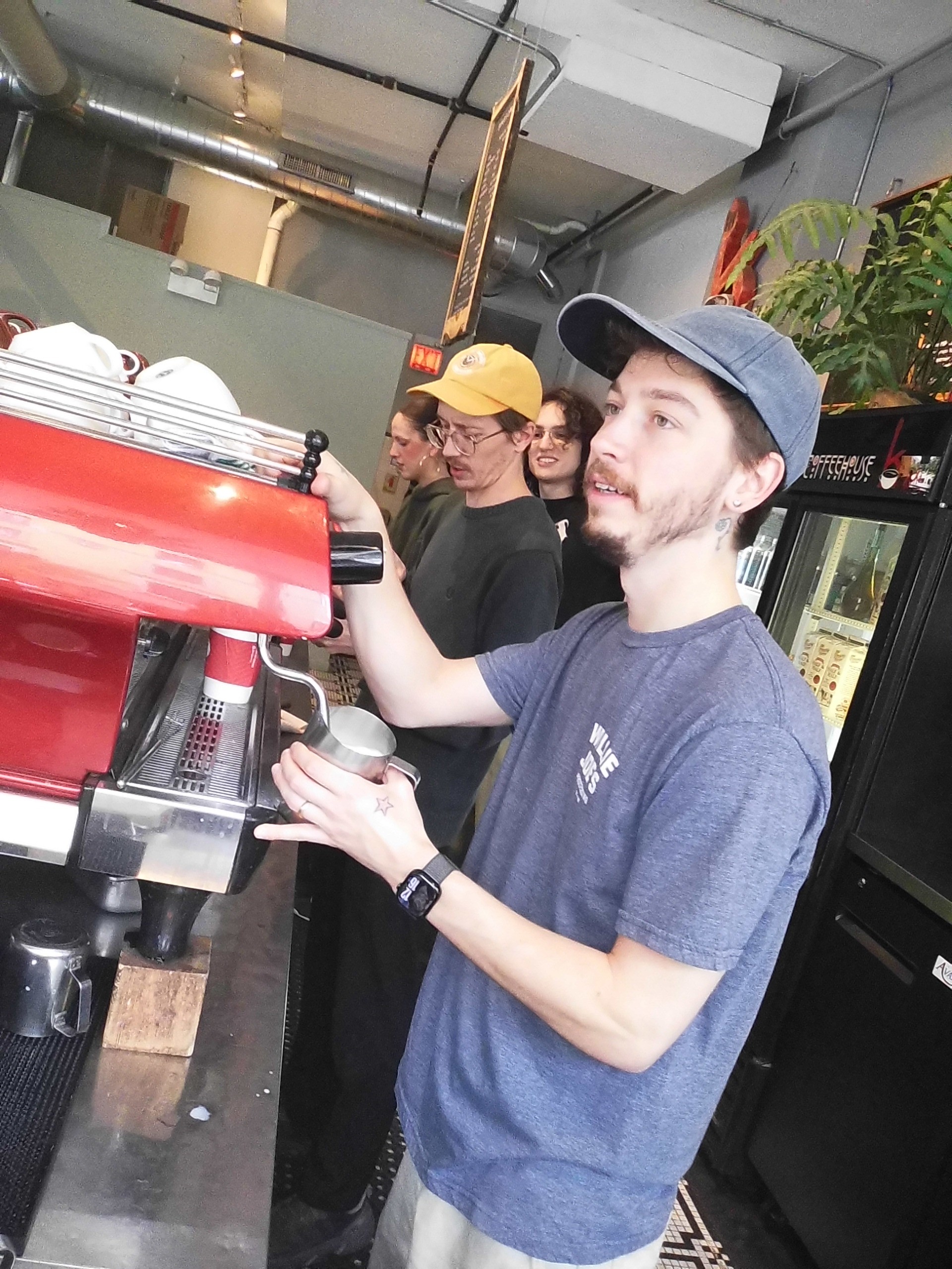 photo of Elijah at the espresso machine