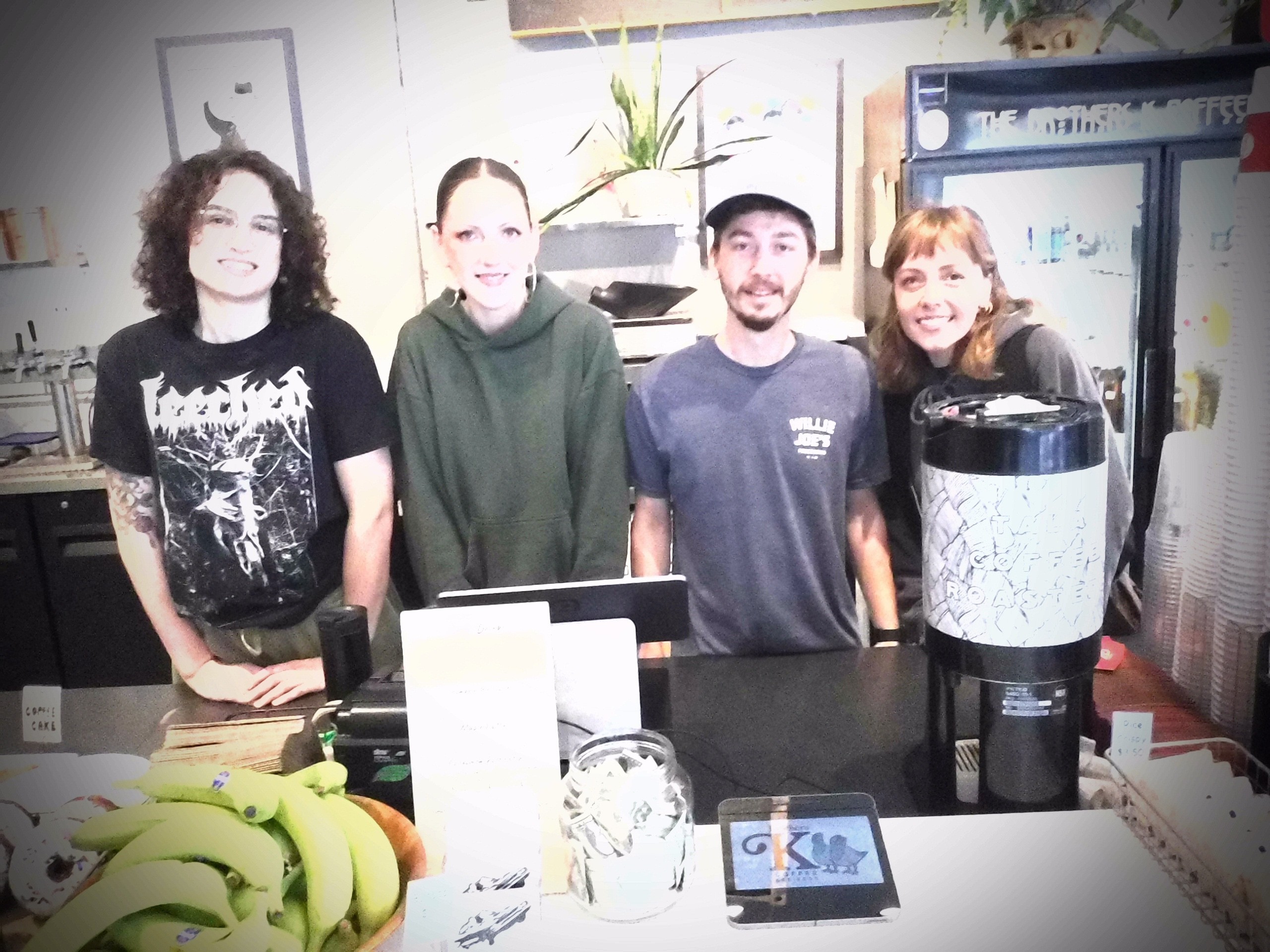 Group photo of staff behind counter